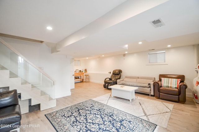 living area featuring recessed lighting, stairway, baseboards, and wood finished floors