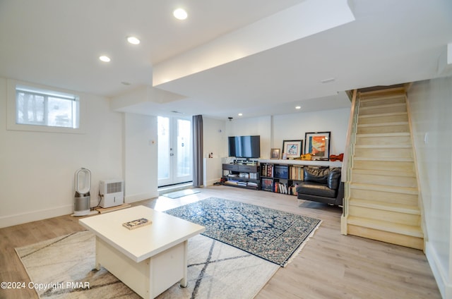 living area with french doors, light wood finished floors, recessed lighting, baseboards, and stairs