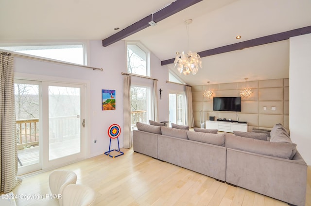 living area with high vaulted ceiling, wood finished floors, beam ceiling, and a notable chandelier