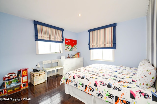 bedroom with hardwood / wood-style flooring and recessed lighting