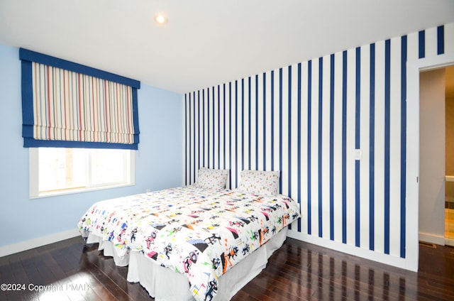 bedroom with baseboards, hardwood / wood-style floors, and recessed lighting