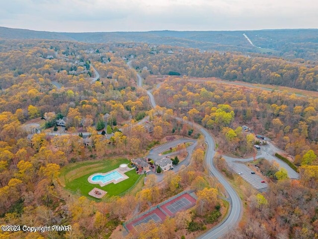 aerial view with a wooded view