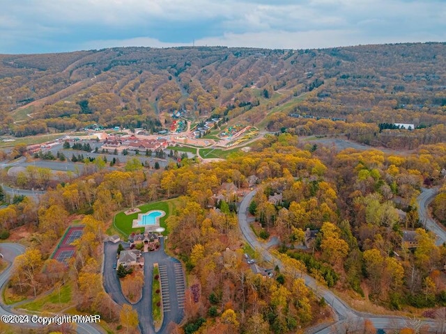 drone / aerial view featuring a view of trees