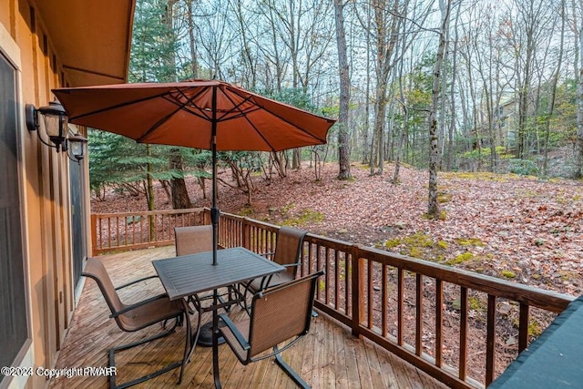 deck featuring outdoor dining space