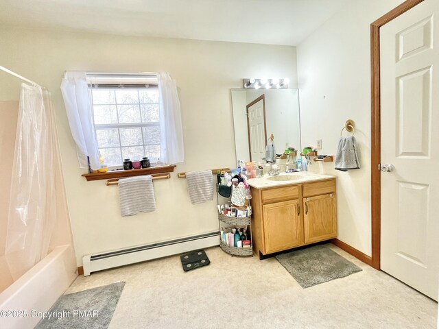 bathroom with shower / tub combo, vanity, and a baseboard radiator