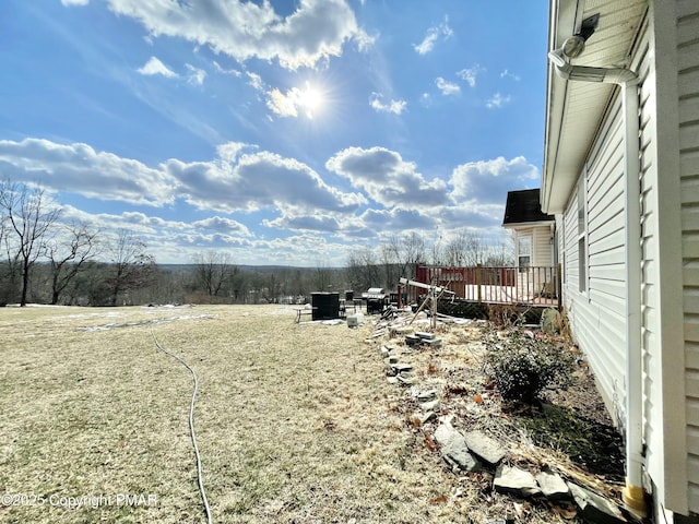 view of yard featuring a deck