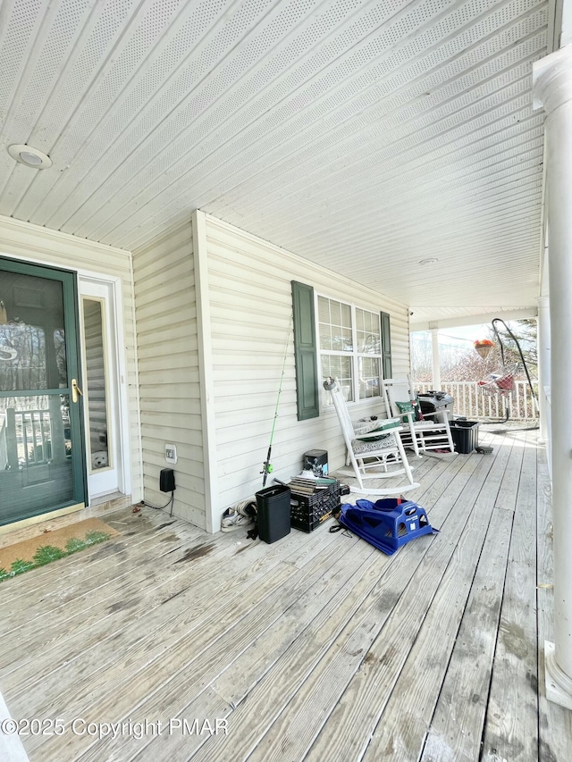 deck with covered porch