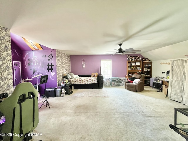 carpeted bedroom featuring lofted ceiling and ceiling fan