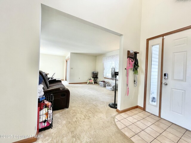 entryway featuring light carpet