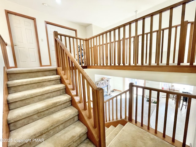 stairway with hardwood / wood-style floors