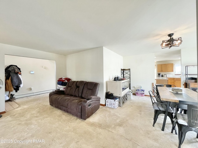 living room with a baseboard radiator and light colored carpet