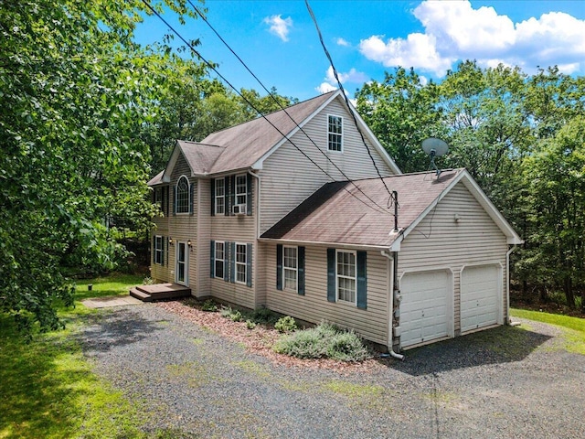 2615 Vista Dr, Blakeslee, PA 18610 - view of front facade with gravel driveway, an attached garage, and a shingled roof