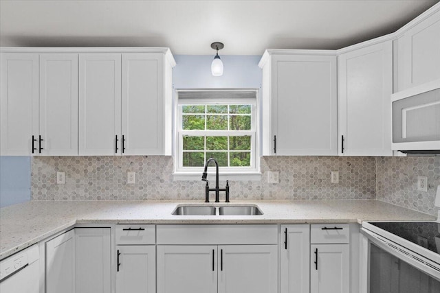 2615 Vista Dr, Blakeslee, PA 18610 - kitchen with white appliances, white cabinetry, tasteful backsplash, light stone counters, and pendant lighting