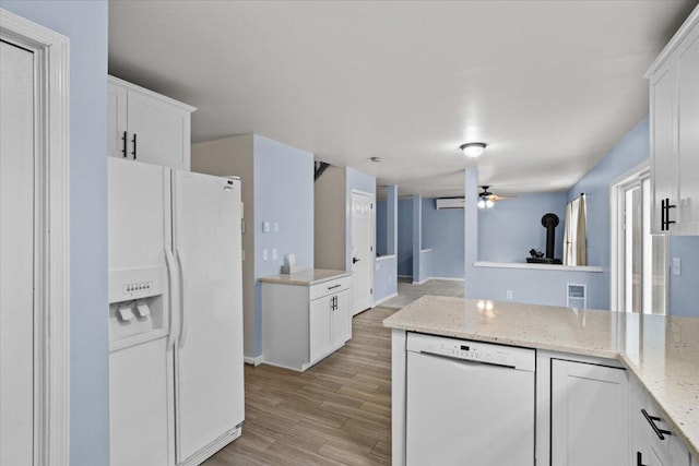 2615 Vista Dr, Blakeslee, PA 18610 - kitchen featuring white appliances, white cabinets, ceiling fan, light wood finished floors, and light stone counters