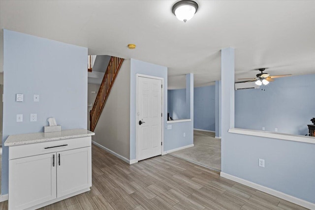 2615 Vista Dr, Blakeslee, PA 18610 - unfurnished living room with a ceiling fan, light wood-style floors, and stairway