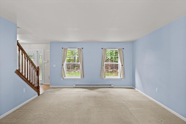 2615 Vista Dr, Blakeslee, PA 18610 - unfurnished room with a baseboard heating unit, carpet, and stairs