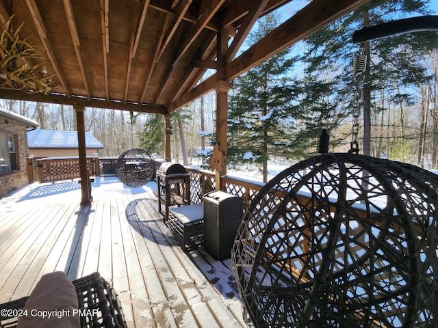 wooden deck featuring grilling area