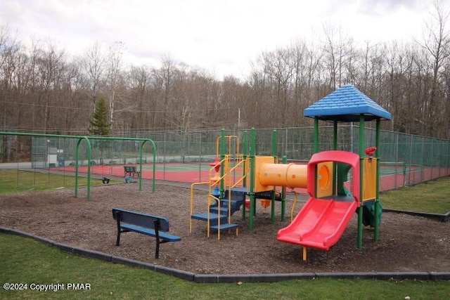 communal playground featuring fence