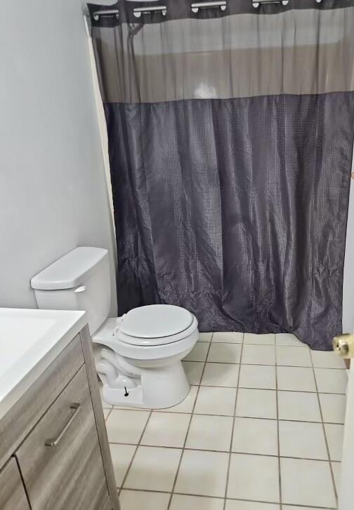 328 Crewe Ct, Bushkill, PA 18324 - bathroom featuring vanity, toilet, tile patterned floors, and a shower with shower curtain