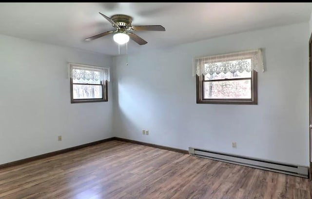 1019 Jackson View Rd, Stroudsburg, PA 18360 - spare room with a baseboard radiator, wood finished floors, a ceiling fan, and baseboards