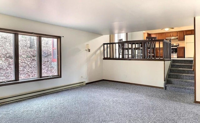 1019 Jackson View Rd, Stroudsburg, PA 18360 - unfurnished living room with carpet, a baseboard heating unit, stairway, and baseboards