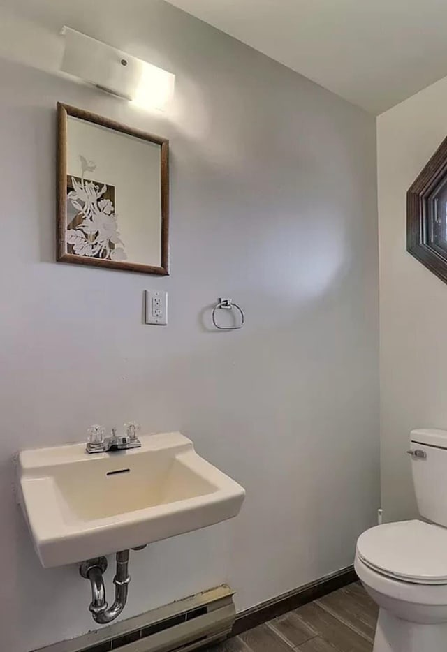 1019 Jackson View Rd, Stroudsburg, PA 18360 - half bath featuring toilet, wood finished floors, a sink, and baseboards