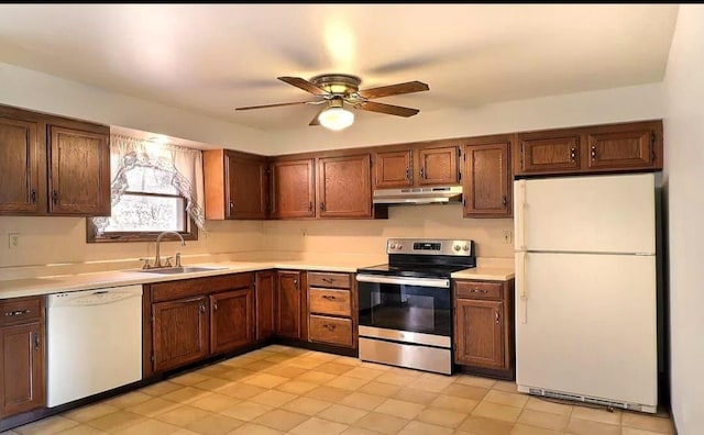 1019 Jackson View Rd, Stroudsburg, PA 18360 - kitchen with white appliances, under cabinet range hood, a sink, and light countertops