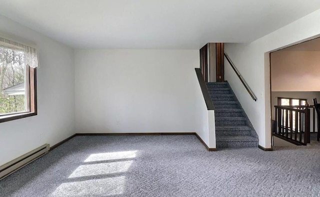 1019 Jackson View Rd, Stroudsburg, PA 18360 - unfurnished living room with a baseboard radiator, carpet flooring, plenty of natural light, and stairway