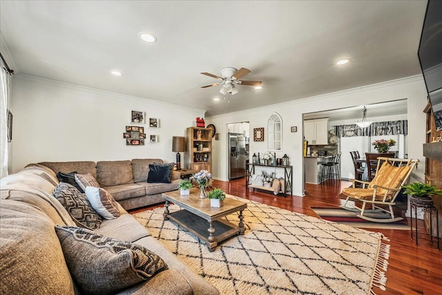 living room featuring recessed lighting, ornamental molding, a ceiling fan, and wood finished floors