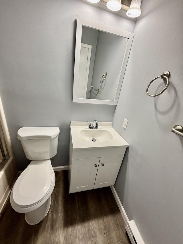 1223 Coolbaugh Rd, East Stroudsburg, PA 18302 - bathroom with wood finished floors, toilet, vanity, baseboards, and a shower