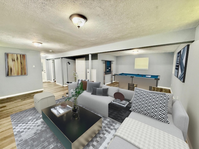 1223 Coolbaugh Rd, East Stroudsburg, PA 18302 - living room with wood finished floors, a textured ceiling, baseboards, and billiards table