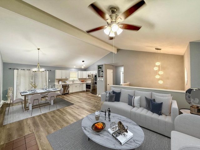 1223 Coolbaugh Rd, East Stroudsburg, PA 18302 - living room with a chandelier, light wood-type flooring, and a ceiling fan