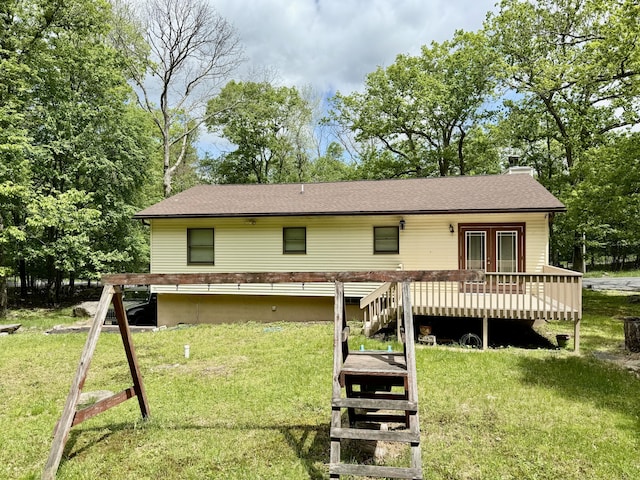 1223 Coolbaugh Rd, East Stroudsburg, PA 18302 - rear view of property featuring a deck, a yard, a chimney, and roof with shingles