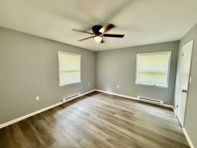 1223 Coolbaugh Rd, East Stroudsburg, PA 18302 - spare room with a baseboard heating unit, ceiling fan, baseboards, and wood finished floors