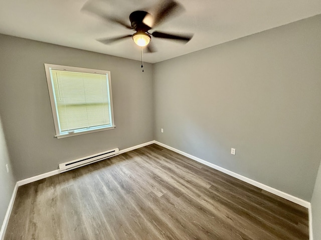 1223 Coolbaugh Rd, East Stroudsburg, PA 18302 - unfurnished room with a baseboard heating unit, a ceiling fan, dark wood-type flooring, and baseboards