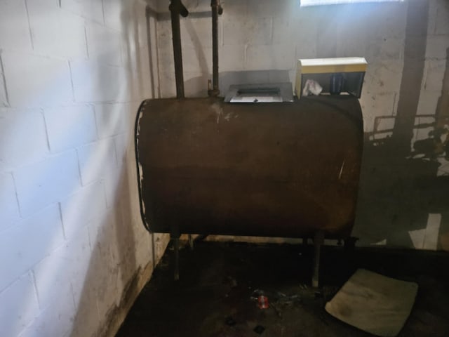 159 Summit Ave, Pocono Summit, PA 18346 - unfinished basement featuring oil tank and concrete block wall
