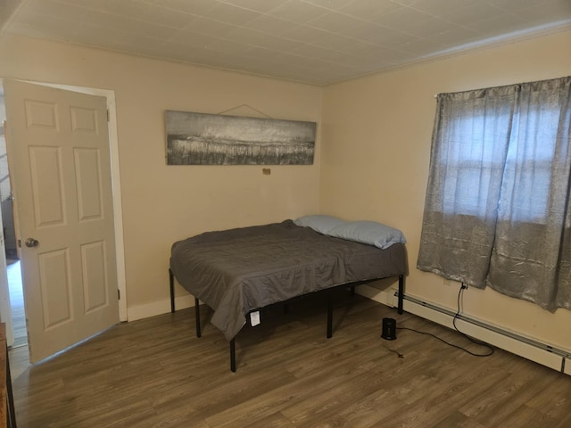159 Summit Ave, Pocono Summit, PA 18346 - bedroom with wood finished floors and a baseboard heating unit