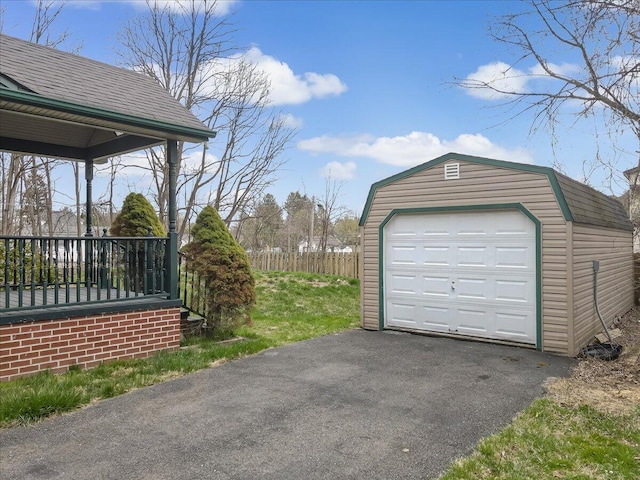 detached garage featuring driveway