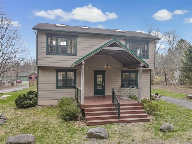 view of front of house featuring a porch and a front lawn