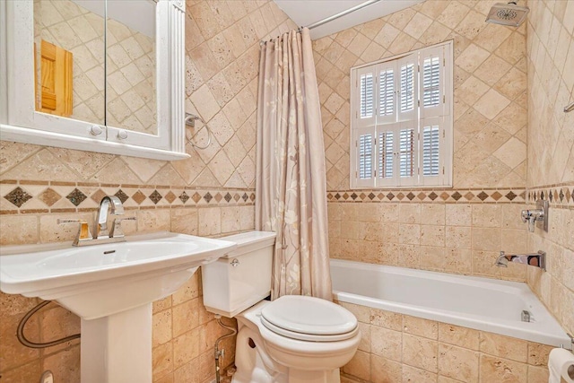 bathroom featuring toilet, tile walls, and tiled shower / bath