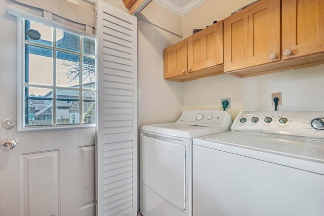 laundry room with a wealth of natural light, independent washer and dryer, crown molding, and cabinet space