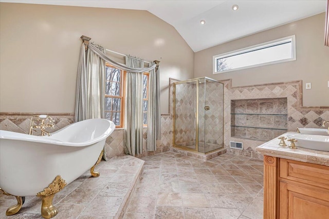 full bath with tile walls, visible vents, a shower stall, and lofted ceiling