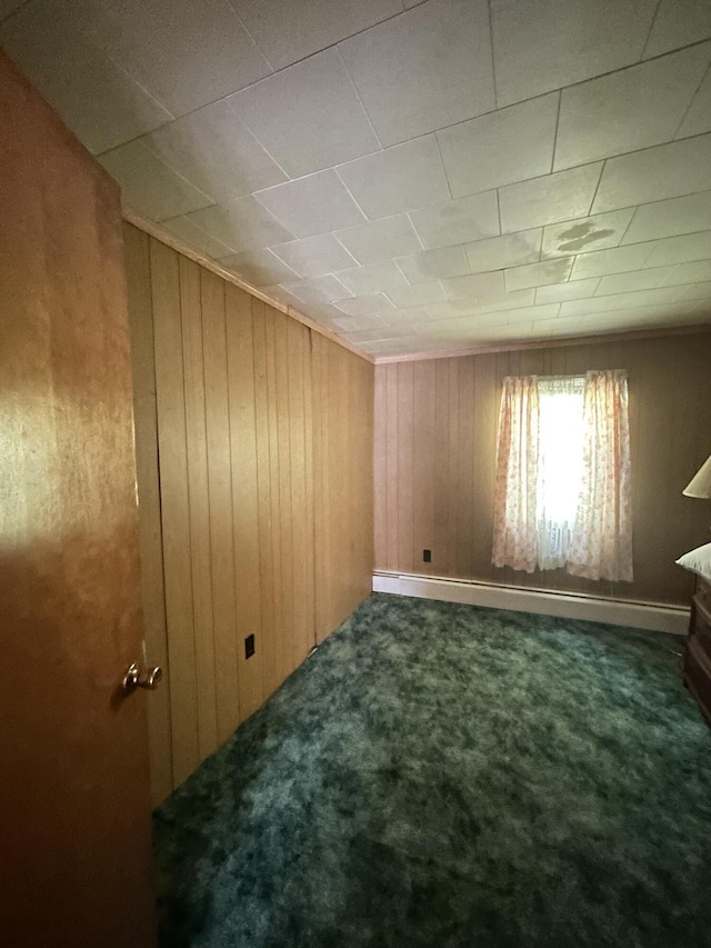 70 Indian Run Rd, Weatherly, PA 18255 - carpeted spare room with wood walls and a baseboard heating unit