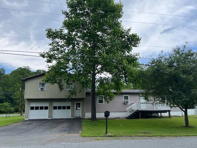 501 Lake Spangenberg Rd, Jefferson Township, PA 18436 - view of front of house with asphalt driveway, a front yard, and an attached garage