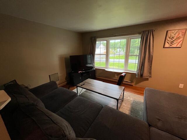 501 Lake Spangenberg Rd, Jefferson Township, PA 18436 - living room featuring wood finished floors and baseboard heating