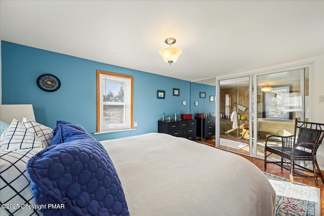 bedroom with hardwood / wood-style floors