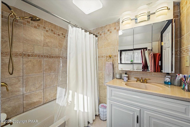 full bath with shower / bath combination with curtain, tile walls, and vanity