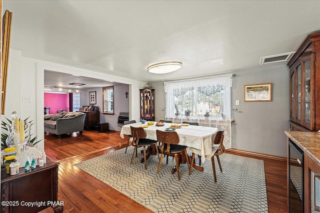 dining room featuring dark hardwood / wood-style flooring