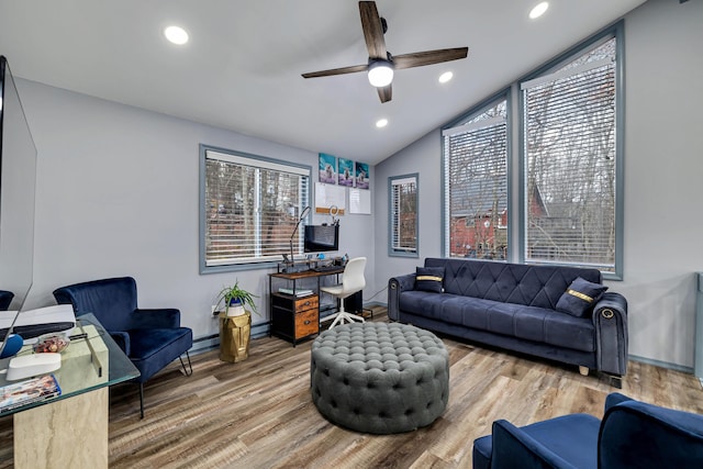 living room featuring vaulted ceiling, ceiling fan, wood finished floors, and recessed lighting