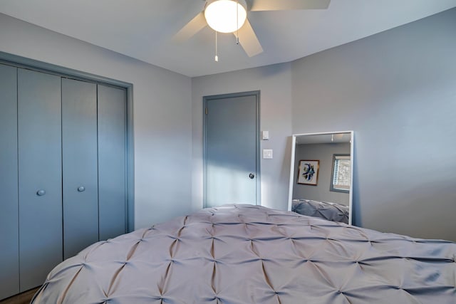 bedroom featuring ceiling fan and a closet